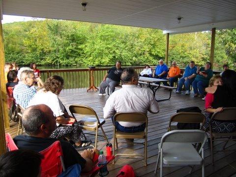 Reflection center deck with people sitting in a circle talking