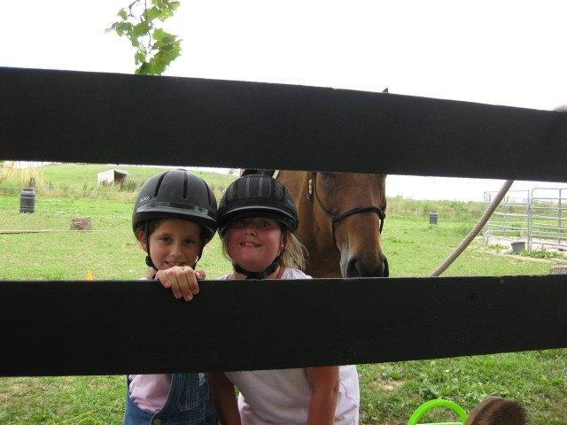 2 campers looking thru the fence